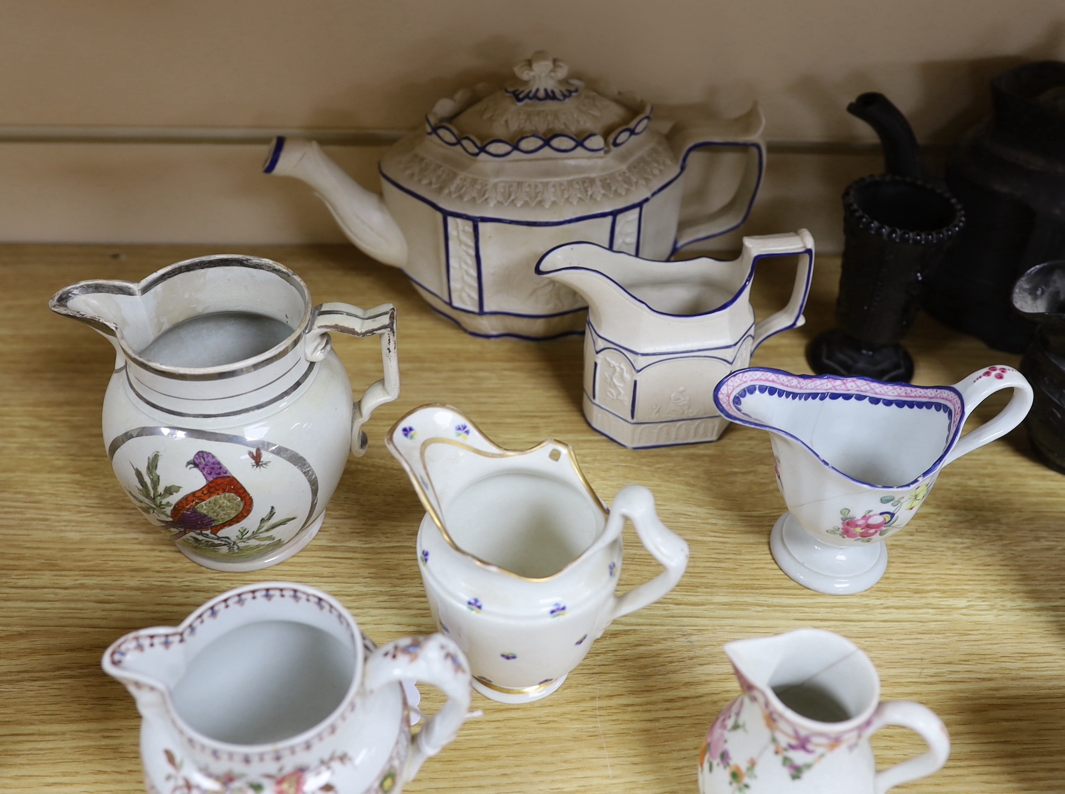 A collection of Regency stoneware and porcelain tea wares, including a small collection of black basalt, Castleford type etc. tallest teapot 17cm high